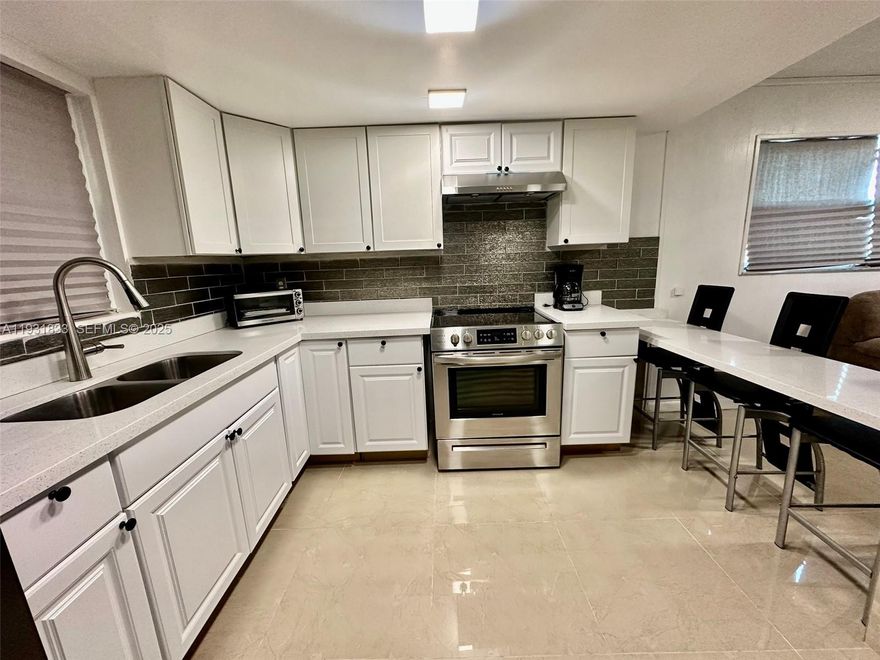 This waterfront property features a remodeled kitchen, 3 bedrooms, 1 bathroom, and ample outdoor space. Situated on approximately 18,000 sq ft, it offers plenty of room to park multiple cars, boats, or an RV. The property includes a boat ramp, lift, and deck along the canal from Lake Okeechobee, perfect for backyard fishing. Fully fenced for privacy, it also includes a smaller rental house at the back. No HOA with quick approval available.