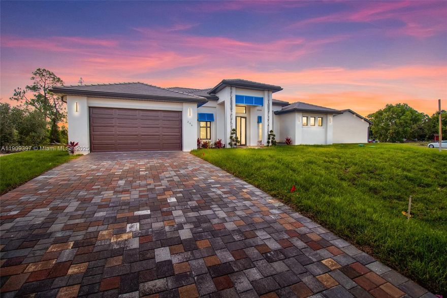 Modern Elegance with a Colonial Touch! Welcome to your dream home in Lehigh Acres! This brand-new construction makes a bold first impression with its grand entryway, tile roof, and symmetrical architecture accented by colonial-style columns. The deep-toned garage, double French doors, and chic blue awnings add a pop of character and style making it feel coastal and yet modern. Step into elegance with this stunning 3-bedroom + office, 2-bath home offering over 2,000 sq. ft. of living space! Located in one of the most desirable zip codes in Lehigh Acres, this home boasts high-end features and thoughtful design throughout. Features You’ll Love! Luxury granite countertops & light-up kitchen cabinets. Formal dining room perfect for entertaining. Porcelain tile flooring throughout.