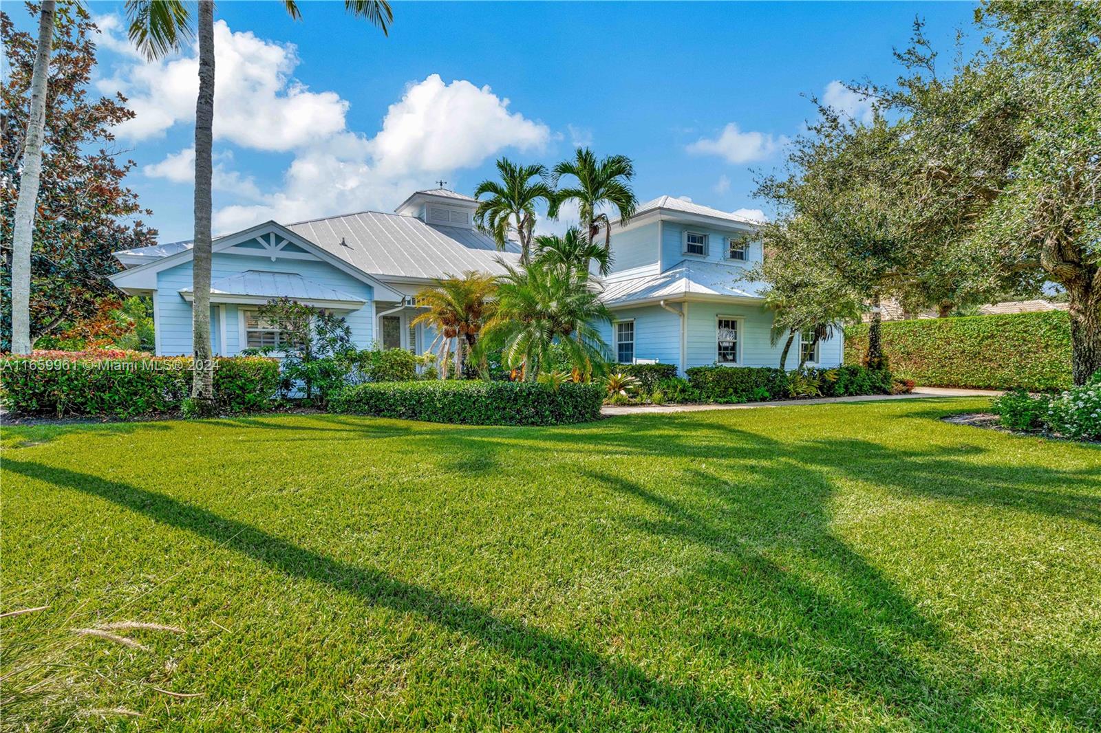 This charming Key West-style home perfectly blends tropical style and modern comfort, ensuring a relaxing yet luxurious stay in Hobe Sound. This fully furnished 4-bedroom, 3-bathroom home with a dedicated boat slip is nestled in the prestigious, gated community of The Sanctuary in Hobe Sound; it is available for a seasonal or annual rental. This private community is directly next to Peck Lake, with access to the Intracoastal Waterway. Enjoy the heated screened-in pool and beautifully landscaped yard, perfect for relaxation and entertaining. Just minutes from stunning beaches and local amenities, the boat slip is equipped with a high-speed lift rated for 6,000 lbs, accommodating up to a 23-foot boat, making boating a breeze.