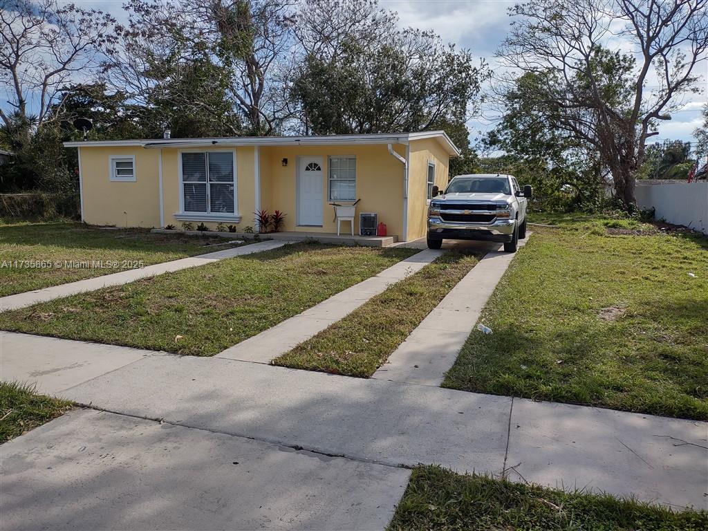 cbs house 935 sqft 2 bedroom 2 bath house has new flooring new kitchen cabinets with island and built in china cabinet in dining room, butcher block top on island. tile backslash in kitchen and dining room kitchen has all appliances, washer and dryer included new tile showers fresh paint interior and exterior fenced back yard with mature shade trees, .25 acre lot in the county, low taxes and sidewalks