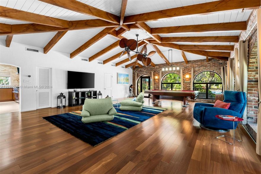 Welcome to ‘The Break Room’, a bucolic retreat nestled in the heart of Miami. This expansive acre home offers a tranquil escape without actually leaving the zip code. For you house hunters, If acquiring a one-level home that includes a detached + fully equipped Casita, then your dreams have been realized. With a sprawling lot size of 40,293 SF, a 4-bed main house PLUS the Casita quarters, it's easy to see why this offering is indeed invaluable and unmatched. The gated residence also features a porte-cochere entry, volume ceilings, expansive living areas, split bedroom plan and lots of other bells and whistles. The Break Room’s pastoral grounds are the result of proud owners who have lovingly and poetically maintained its gardens and who are now ready to pass the baton. Proceed accordingly.