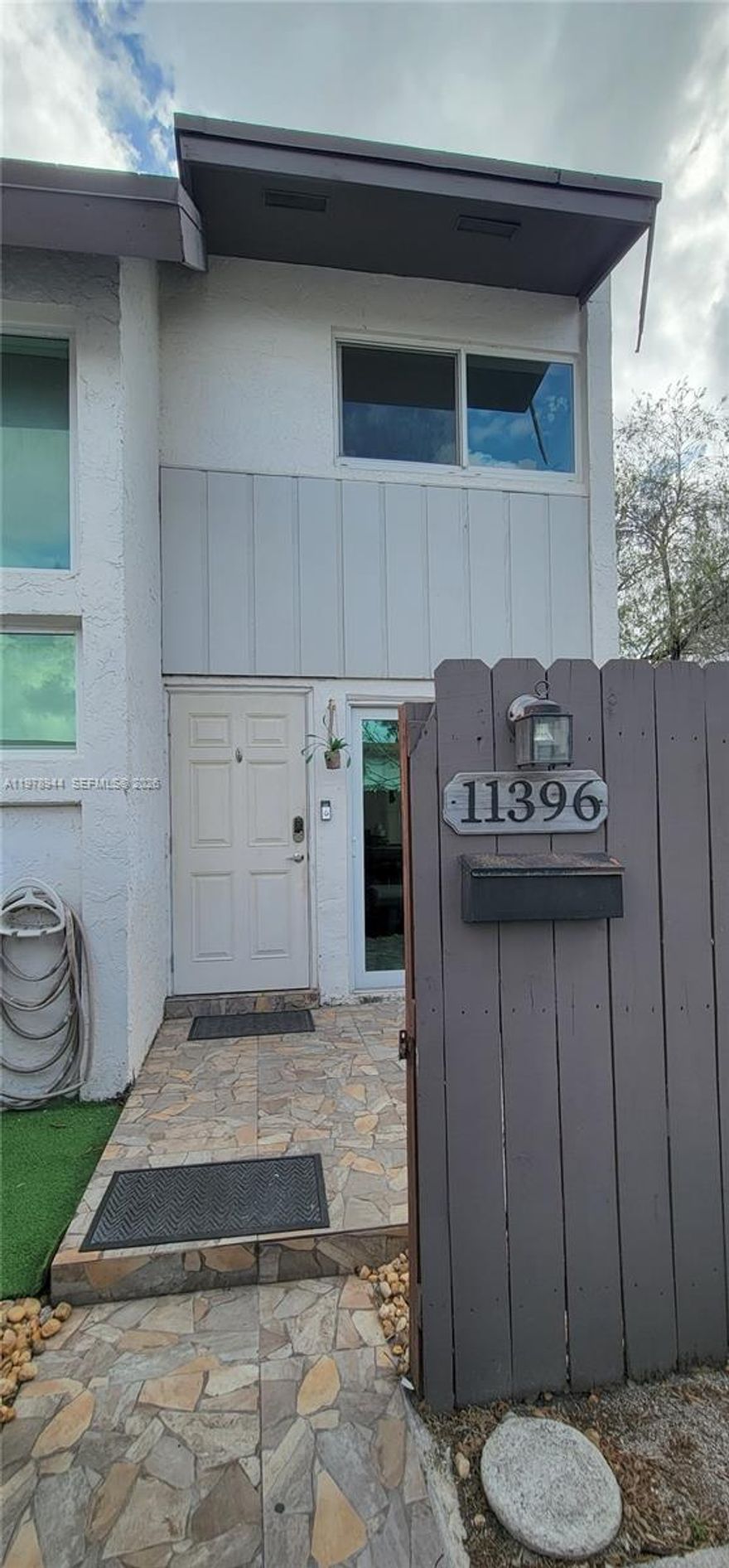 This charming corner-unit 3bd/2bth townhome features a beautifully updated kitchen (2022), newer appliances (2022), and a fully renovated upstairs bathroom and flooring. The popcorn ceilings have been removed for a clean, modern look. Enjoy peace of mind with hurricane impact windows and doors installed in 2022. A convenient bedroom and full bathroom are located on the first floor. The backyard is fully fenced in and perfect for relaxing or hosting outdoor gatherings.