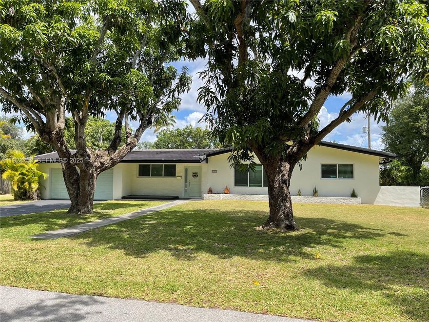 A rare opportunity in Mangowood! This beautifully renovated 3-bed, 2-bath home, with a total living space of 2,851 sq. ft., sits on one of the neighborhood’s most quiet, picturesque streets and showcases designer finishes throughout. Its light-filled open layout features impact windows and doors, a new roof, new plumbing, and stunning Spanish porcelain flooring. The kitchen and baths have been reimagined with modern style and quality craftsmanship. An inviting pool & spacious covered patio create the perfect setting for year-round entertaining. Just steps from Coral Reef Park, the Deering Estate, and top-rated public, magnet & private schools. With tenants occupying the home until April 30, 2026, you have a remarkable opportunity: close early and start earning rental income ($7,200 a month), or close on May 1, 2026.