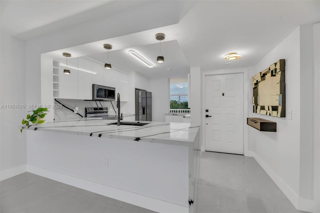 Photo of 2601 N Nob Hill Rd #407, Sunrise, FL 33322 (MLS # A11953526)