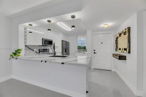 Photo of 2601 N Nob Hill Rd #407, Sunrise, FL 33322 (MLS # A11953526)