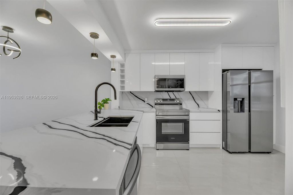 Photo of 2601 N Nob Hill Rd #407, Sunrise, FL 33322 (MLS # A11953526)