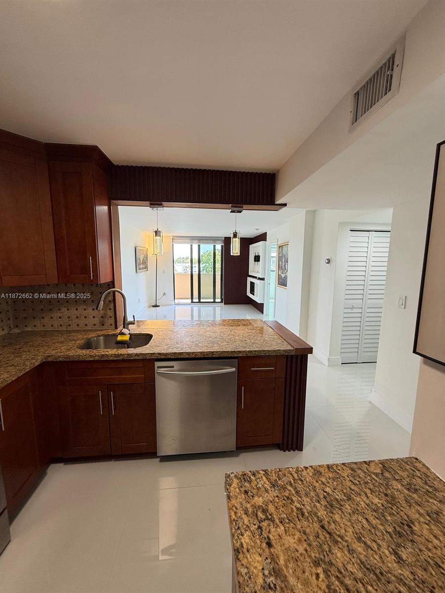 Experience Miami Beach living in this spacious 1,011 sqft condo featuring 2 bedrooms and 2 bathrooms. Filled with natural light, the open layout creates a welcoming atmosphere with a central location close to beaches, dining, and shopping. The kitchen comes equipped with a refrigerator, oven, microwave, and dishwasher, while central AC and heating provide year-round comfort. The primary suite offers privacy with its own bathroom, and the residence includes elevator access, an attached garage parking space, and beautiful water views that add a touch of serenity. Combining comfort, convenience, and style, this condo is an ideal opportunity to enjoy the best of Miami Beach living.