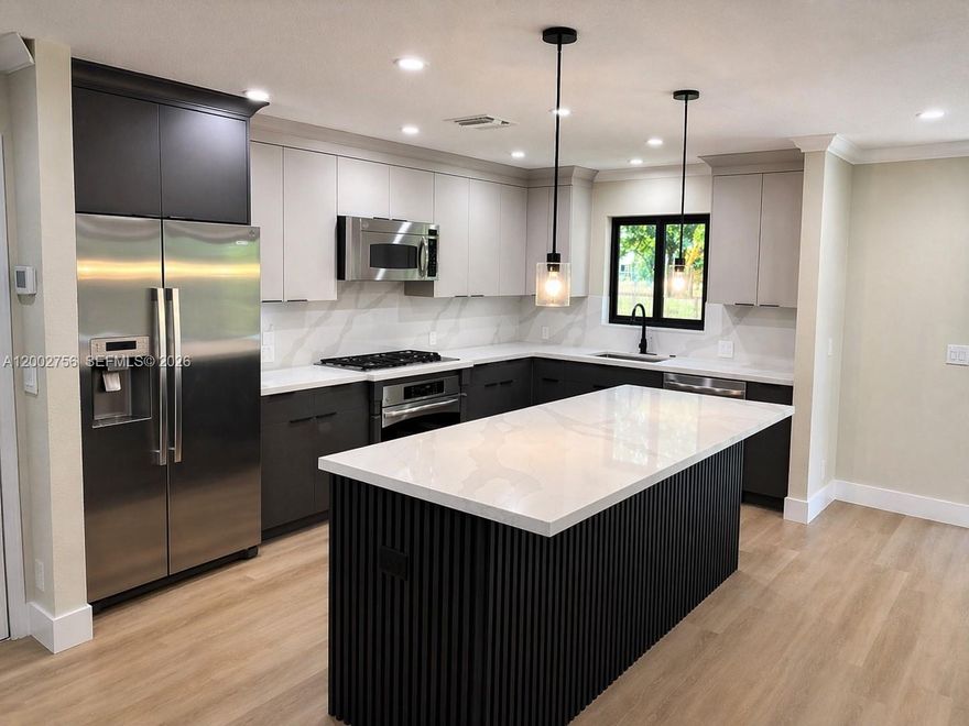 Beautifully 3-Bedroom, 2-Bath Home with 2-Car Garage in Lake Mango Shores! Welcome to this move-in-ready single-family home ideally located off Florida Mango Rd in the desirable Lake Mango Shores community. This property features a new permitted roof (2025), fresh interior paint, and stylish modern vinyl flooring throughout. The updated kitchen with contemporary appliances offers both functionality and appeal for today’s lifestyle. Enjoy a private fenced-in yard, perfect for entertaining. An excellent opportunity for buyers seeking comfort, tranquility, and modern living in a well-established neighborhood. All ages are welcome, Low HOA.