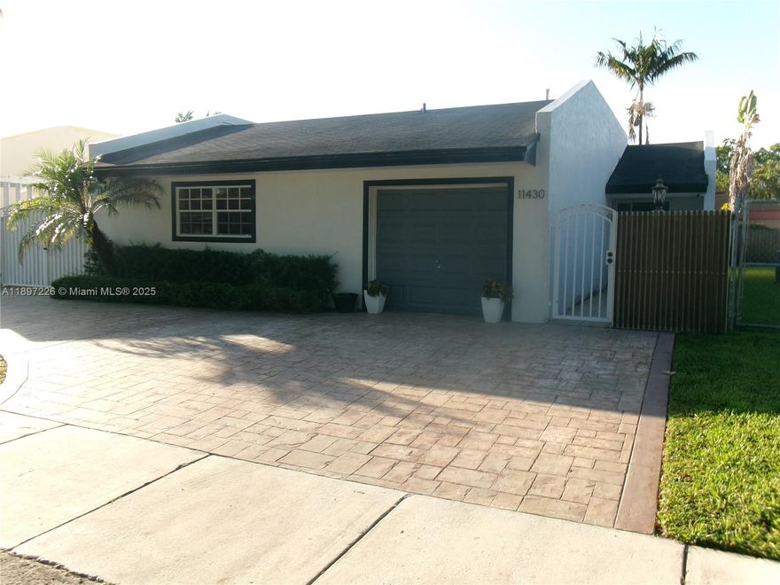 Take advantage of this rare opportunity to own a home in Coral Highlands neighborhood! This charming 3-bed, 2-bath residence features an updated kitchen with quartz countertops, a center cooking island, and stainless steel appliances. Features  wood floor throughout the house, complemented by bathrooms with elegant tile finishes. Additional highlights include a 7-year-old A/C system and a  roof in good condition. There’s potential to add another room if desired. Enjoy a private fenced patio! The property also offers a one-car garage plus driveway parking for three additional vehicles. Situated near major expressways, the Florida Turnpike, and Kendall Drive, this home provides easy access to The Palms at Town & Country Mall, shopping centers, and a variety of restaurants.