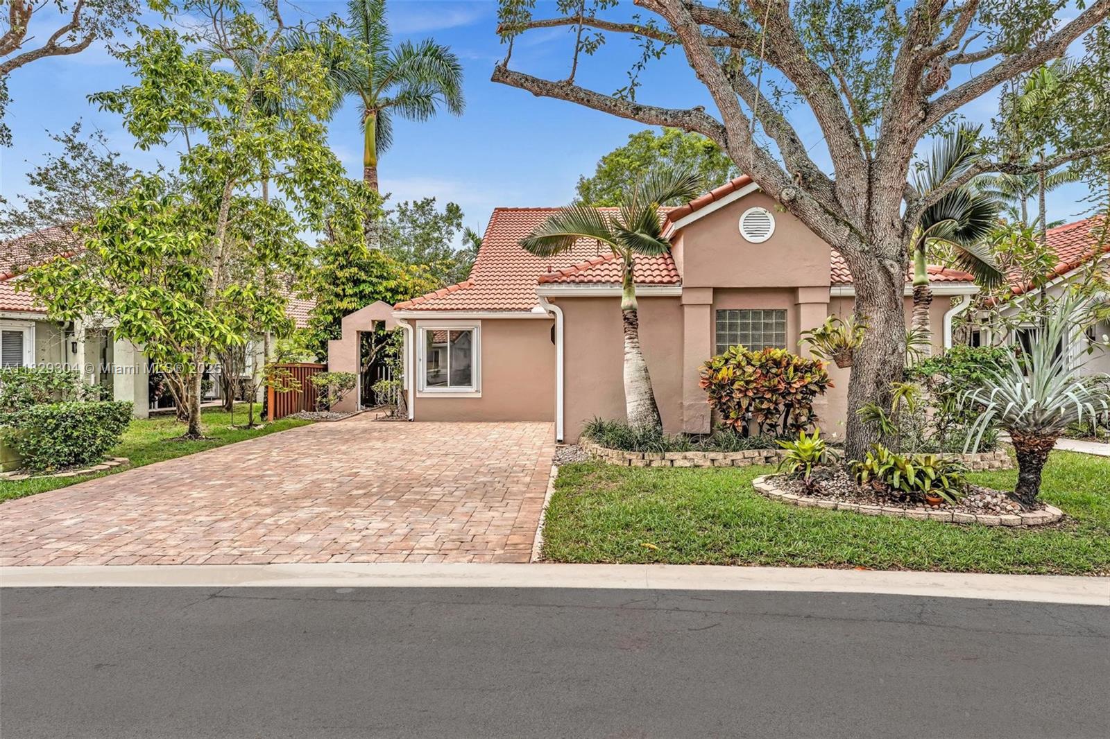 Stunning Waterfront home in Gated Community! Discover this exquisite single-story 3/2 split bedroom floorplan w/2 car garage in Sunset Cove- a prestigious gated comm. with 24/7 manned Security. Perfectly positioned on the coveted Central Park lake. It has breathtaking water views ideal for discerning buyers seeking elegance & tranquility. Inside, experience a bright, airy ambiance, high ceilings & abundant natural lighting streaming thru expansive windows. Every detail of this home exudes sophistication. Features all new porcelain tile, new AC, new copper pipes, full house water filtration system, spa style bath, solar hot water, Shutters, freshly painted, brick paver hardscaping, exotic plants & much more. Prime location, water views & many upgrades make it a rare gem! Sched appt today!