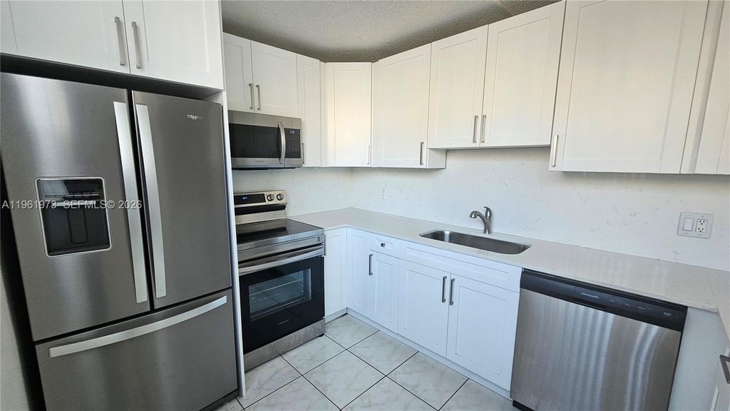 Photo of 9480 Tangerine Pl #101, Davie, FL 33324 (MLS # A11961973)