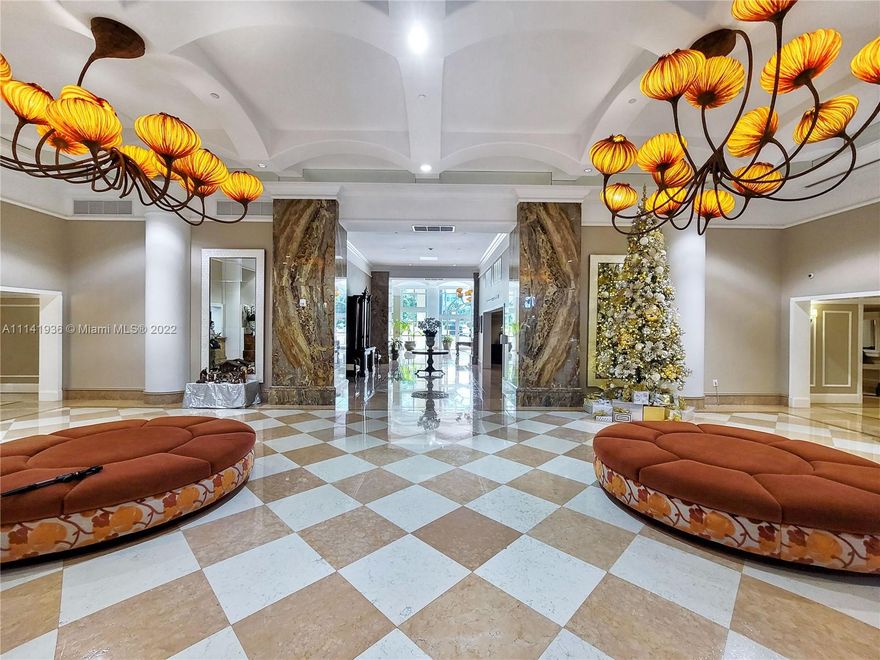 Grand Bay Residences in Key Biscayne has beautiful direct ocean view entering unit -  marble floors throughout - wood floors (bedrooms) - 3 bedroom + den ( convertible to 4th bedroom ) - huge master w/his and hers baths and walk-in closets - service entry to laundry, staff/storage area & bath - elevator access to private foyer - 3 large terraces - resort style living, private beach access w/ chair & umbrella services, pool, spa, gym, valet parking, 24 hour concierge, conference room, media center, next door to Ritz-Carlton - parking space # 396 + 1 valet - storage # 71.