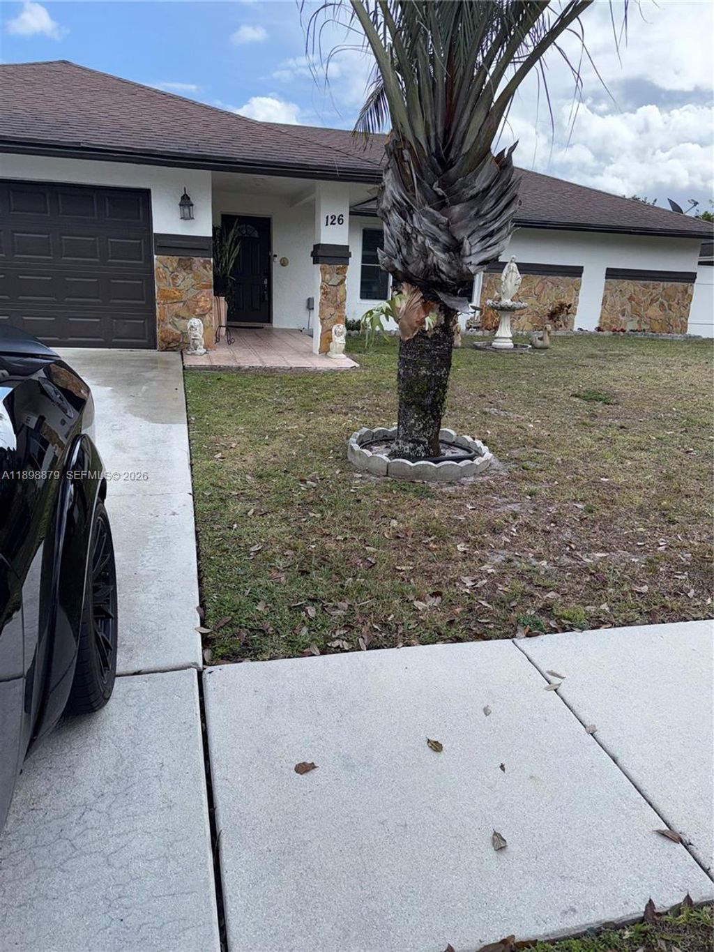 Photo of 126 Sunflower Cir, Royal Palm Beach, FL 33411 (MLS # A11898879)