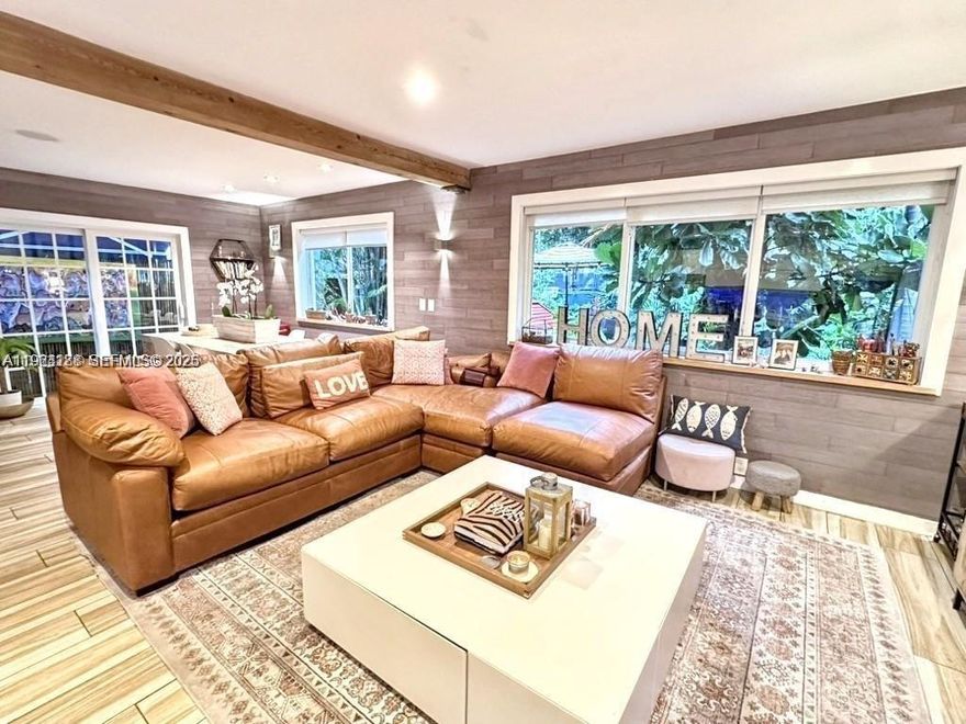 Discover a one-of-a-kind 1,200 sqft beachside retreat with a PRIVATE patio and fenced-in garden. This 2-bedroom, 2-bathroom townhouse features an open-layout kitchen that seamlessly blends style and functionality with a sleek island and state-of-the-art appliances illuminated by soft recessed lighting, perfect for entertaining. The expansive walk-in closet offers abundant hanging space and organized shelving, ideal for a vast wardrobe and accessories. The bathrooms feature great storage, with the first offering a luxury bathtub paired with a modern shower, and the second showcases dual vanities and an elegant contemporary shower. Outside, enjoy a barbecue setup surrounded by meticulously maintained gardens that enhance the luxurious tropical ambiance, all secured with a new roof from 2023.