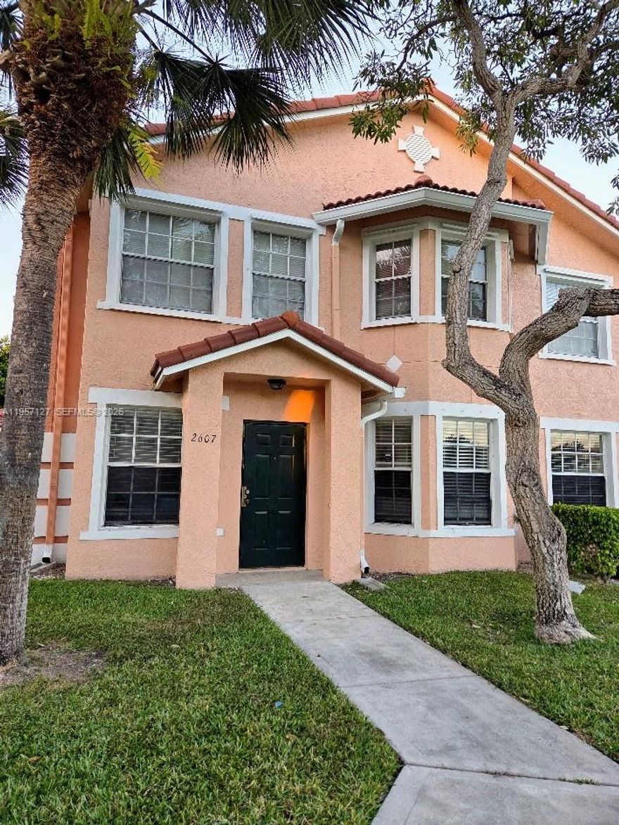 Rarely available unit in Belmont! This is your perfect condo/townhouse unit with 2 car garage! This unit boasts an updated kitchen with quartz countertops and stainless steel appliances. Additionally, the unit includes hurricane shutters and a storage/laundry room. Bathrooms have been updated.  Safe, gated community conveniently located near a shopping center. Your search is over. AS IS.