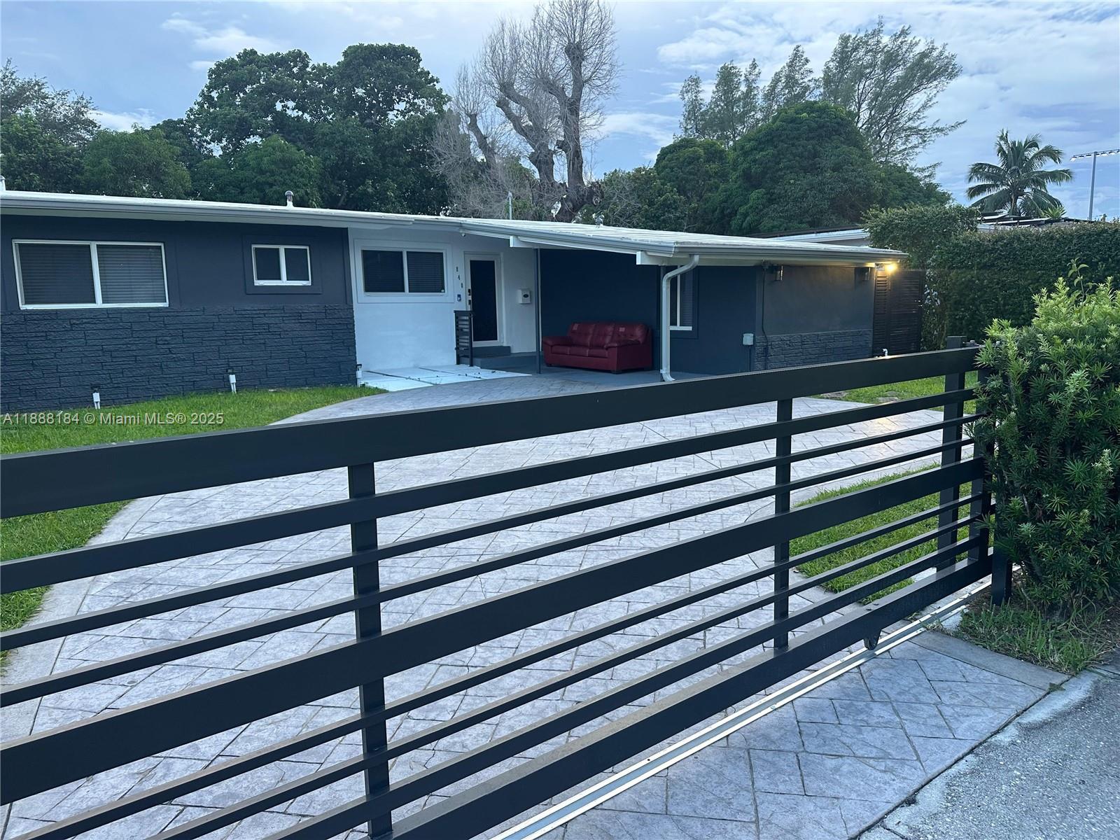 Beautifully updated 3 bed/2 bath single home in North Miami Beach with spacious open layout and large fenced backyard. Features modern kitchen w/ granite counters & 1-year-old stainless appliances, updated baths, tile floors, impact windows, security cameras, and extra den. Covered patio perfect for outdoor living. Bright and airy throughout. Conveniently located near I-95, Palmetto, Turnpike, airports & downtown. Ideal for families. (Ask about adding a 3rd bath.) Owner may complete upgrades during tenancy with tenant cooperation.