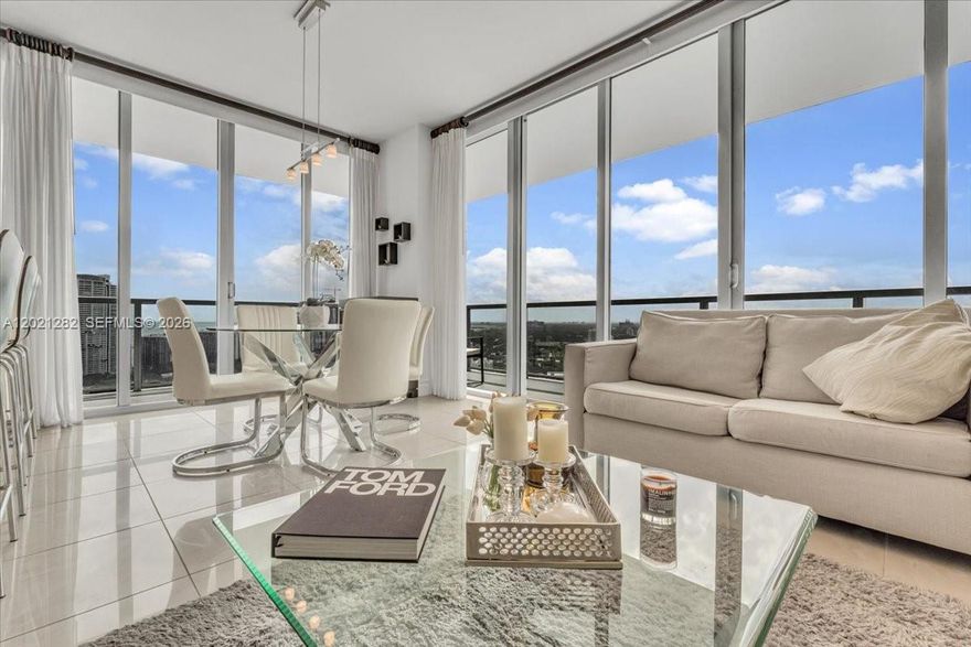 Rare opportunity to own the most coveted layout in the building. A high-floor 01-line corner residence with the best views in either tower, spanning sweeping city and water vistas through floor-to-ceiling windows. This 2-bedroom split-plan corner unit lives bright and open, including a new AC system and water heater. Currently leased at $4,900/month to a quality tenant, offering immediate income for investors or tenant has option to vacate. Resort-style amenities, walkable location, and the prestige of one of the area's most sought-after addresses. Schedule your private showing today.