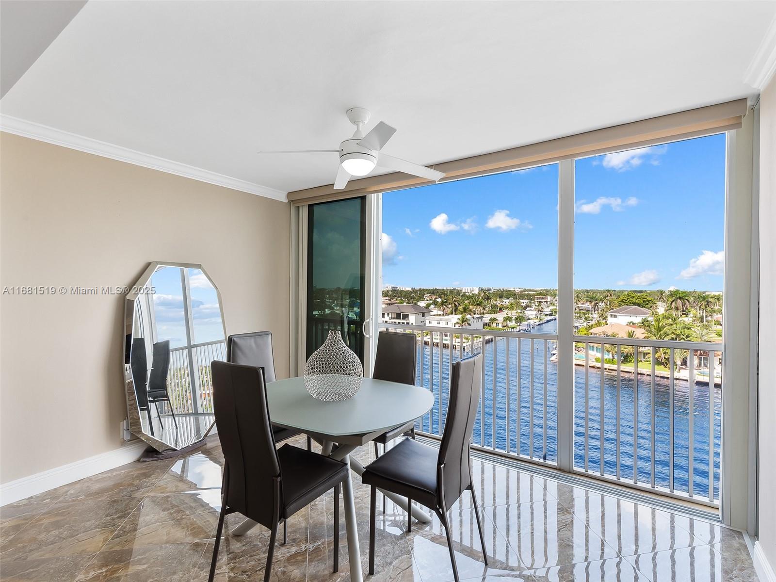 This beautifully renovated condo in the heart of Pompano Beach sits on the Intracoastal, offering breathtaking water views and showcasing yachts and boats gliding by daily. The modern open kitchen is a highlight, featuring brand-new appliances, granite countertops, a chic tile backsplash, and a designated bar with an integrated wine cooler. Porcelain floors extend throughout the main areas of the unit, adding a touch of elegance. The primary bedroom offers a walk-in closet and an ensuite bathroom with double sinks. The enclosed balcony, with fully opening sliding doors, offers the perfect space to soak in the stunning vistas from either your primary bedroom or living room. Add'l features include a laundry room with a washer & dryer, impact windows for enhanced safety and covered parking.