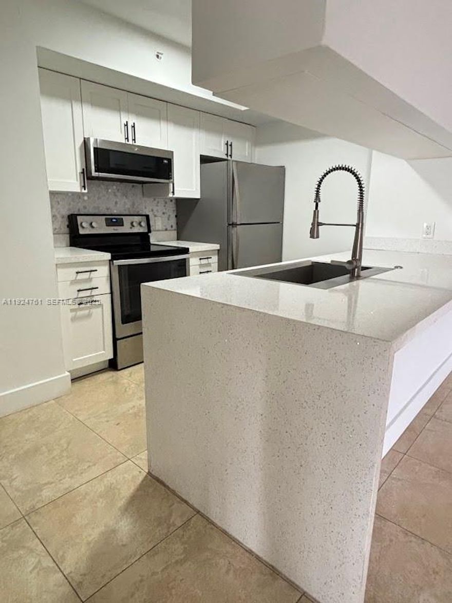 Very spacious and completely remodeled corner unit with luxury wood flooring and tile throughout, stainless steel appliances, open kitchen, quartz countertop, designer bathroom vanities, LED lighting, new electrical outlets, new faucets, full-size washer and dryer, double balcony, 2 assigned parking spaces, and additional cars can park in guest parking. Located on the second floor. Spacious bedrooms and closets, with walk-in closets in the master bedroom. Rent includes cable, internet, waste, water, and sewer. Only pay for electricity. Gated community includes pool, fitness center, BBQ area, and much more. Pets ok, with a fee as per condo rules credit score must be above 640. Easy to show, unit is vacant.