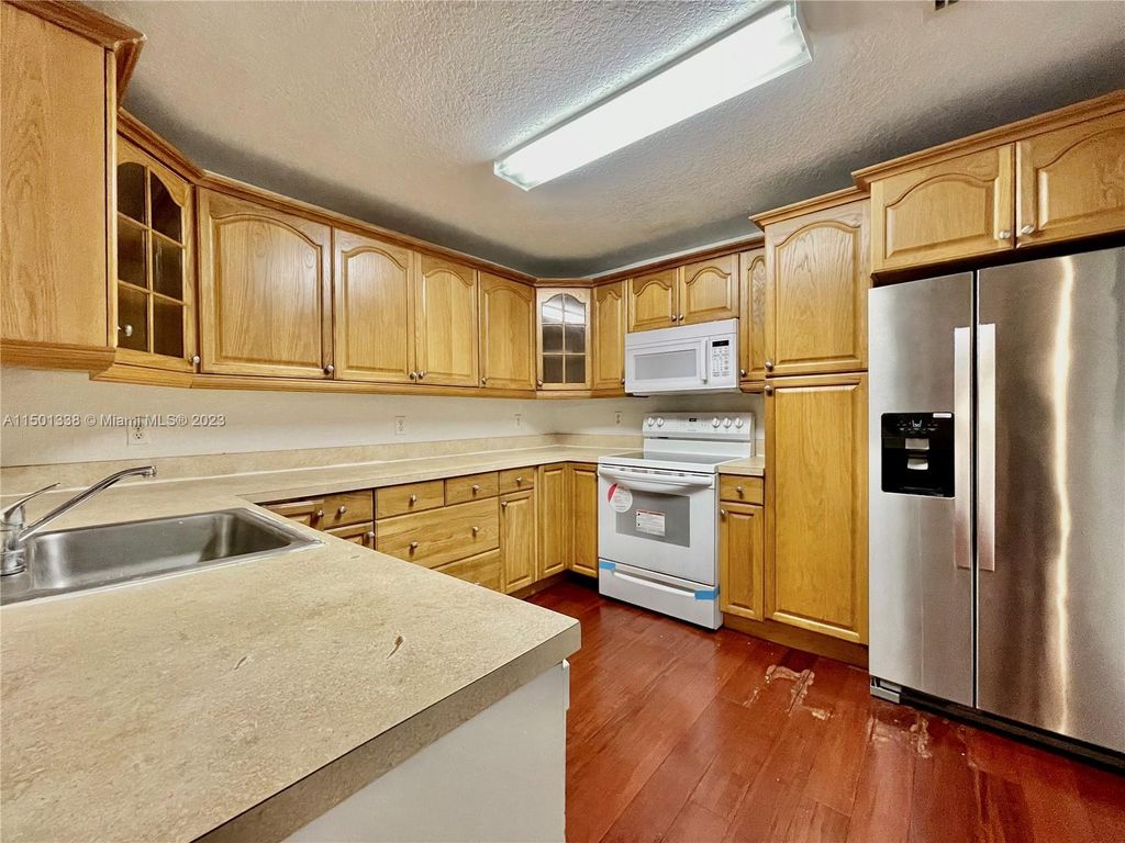 Photo of 11527 NW 43rd Ct #11527, Coral Springs, FL 33065 (MLS # A11501338)