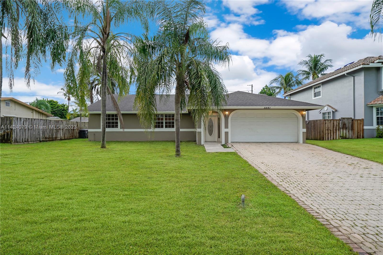 This three bedrooms, two bath home is in a highly desirable Lake Worth neighborhood. The home features high ceiling and ceiling fans. The kitchen boast granite countertops and plenty of storage space for all your needs. There is tile throughout the home, including the two-car garage. The large backyard is fenced-in with a patio.