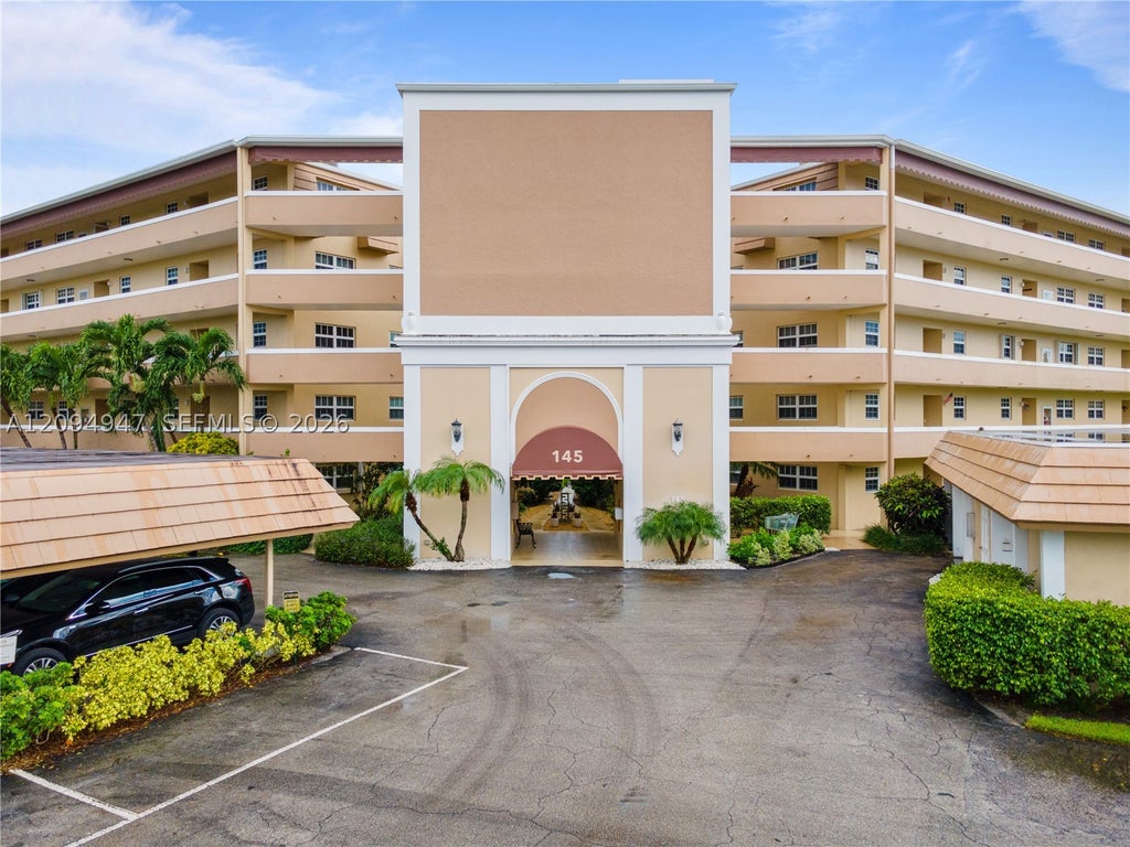 Photo of 145 Atlantis Blvd #101, Atlantis, FL 33462 (MLS # A12094947)