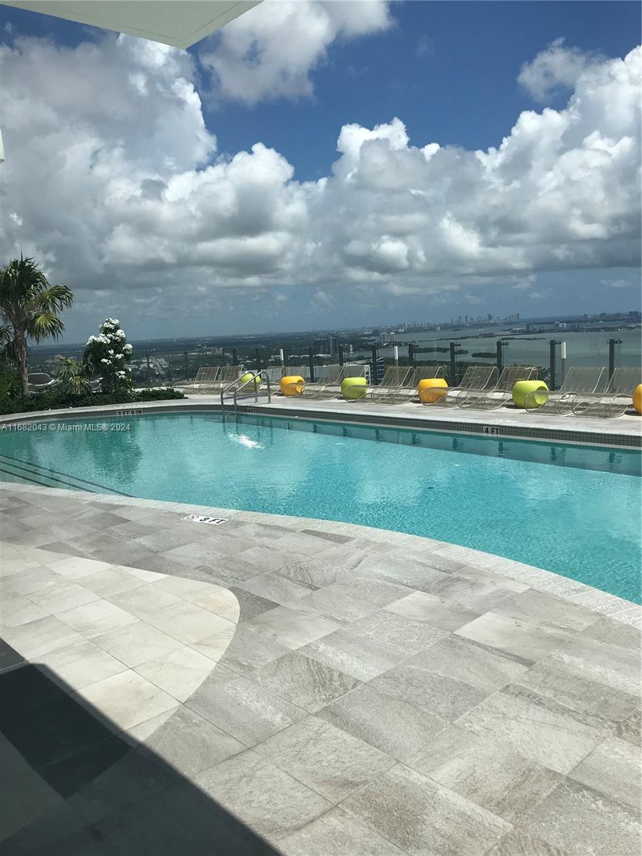 (06) best line in the building. Spacious corner unit with spectacular bay and ocean views features 3b/2 b, floor to ceiling windows, 9+ feet ceilings, Bosch kitchen appliances, huge 500 sf wrap around balcony. Building has countless amenities includes a roof top pool on the 46th floor with 360-degree views, tennis courts, movie room, spa, party room, state of the art fitness center, BBQ area, an additional pool on the 5thfloor, kids room, a business center, basketball court and a billiard room. Paraiso District, an over 12 acres development project consists of a bay-front park, boardwalk & the famous "AMARA restaurant in a superb location walking distance to Midtown, the Design District & Wynwood.