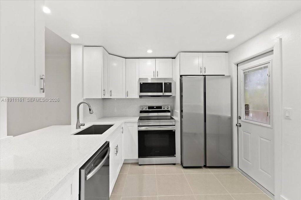 Photo of 319 NE 14th Ave #201, Hallandale Beach, FL 33009 (MLS # A11911161)