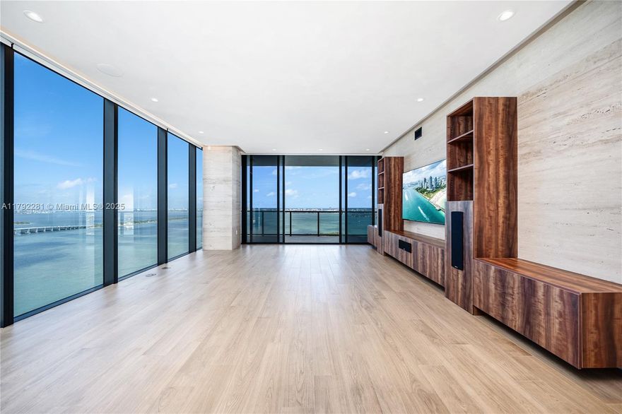 Custom designed by the owner to create a superior, seaside chic home in the sky. With over 3,300 SF of high-end finishes, a private elevator & foyer, this half-floor, flow-thru sky home offers endless 180 degree panoramic Biscayne Bay and Ocean views. The primary suite boasts a massive closet designed by California Closets & spa-like bathroom outfitted w/beautiful marble. The chef's kitchen includes Wolf & SubZero appliances & flows through to the main dining/living room w/never-ending water views from each room. The unit also boasts incredible sunrise & sunset terraces, 3 additional en-suite bedrooms, smart home automation system, & wet-bar w/backlit stone wall. Stunning amenities include a gym, sky lounge, spa, business center, 2 pools w/bar, catering kitchen, & so much more!