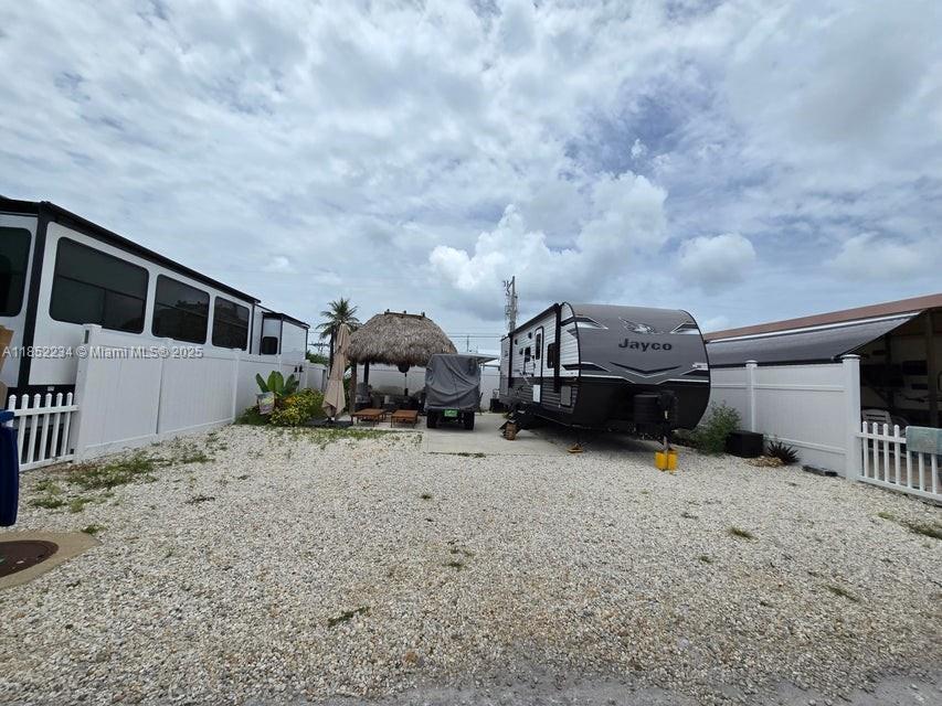 Calusa RV campground is your ideal destination! This versatile getaway delivers the full package: • Prime Water Access: Set just steps from the pool and offering effortless access to some of the best fishing waters in the region. • Room for All Your Toys: Plenty of space to store your boat, jet skis, kayaks, and other aquatic gear — plus ample parking for your RV. • Vacation-Ready & Investment-Savvy: Use it as your personal escape or rent it out when you're away to help offset your investment. This is where laid-back tropical living meets smart ownership. Don't miss your chance to explore it in person — schedule your showing today!