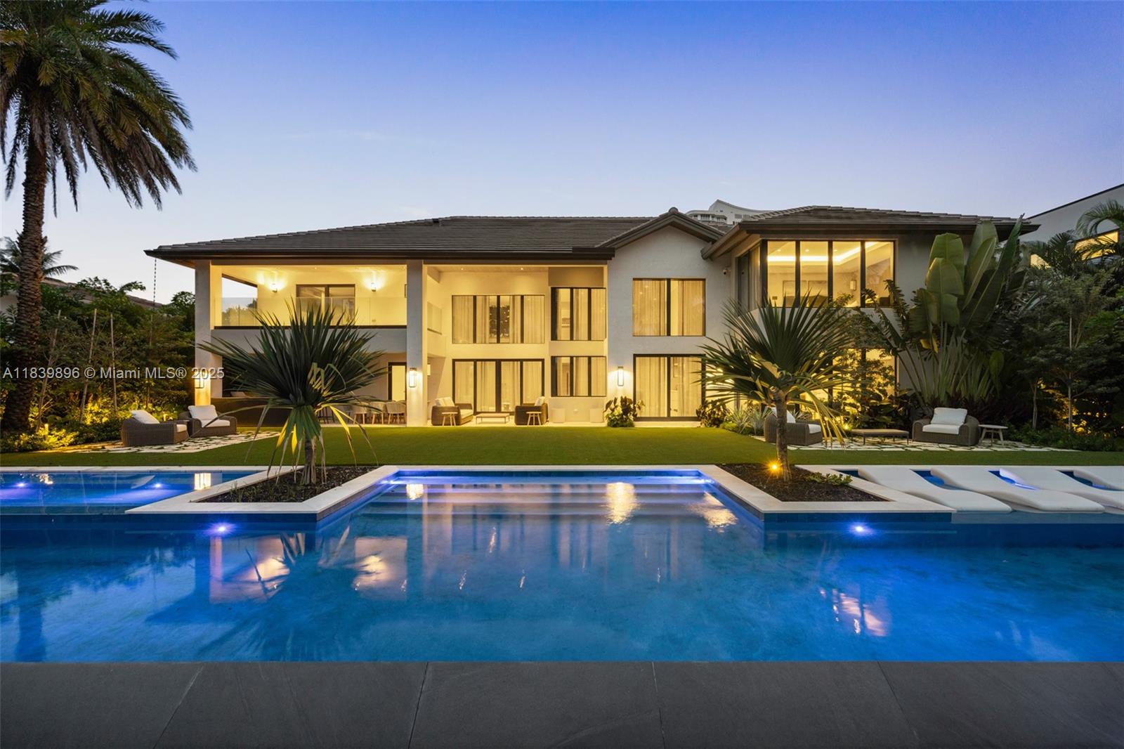 VILLA ENCANTO is a newly reimagined grand waterfront estate in prestigious Golden Isles, designed for those who value space, style, and seamless living. Redesigned by Pietra Casa Studio, this exquisite 6-bed, 7.5-bath residence blends elevated design with livable luxury, featuring premium European hand selected marble and millwork throughout. Thoughtfully curated interiors balance sophistication and comfort, creating an ideal setting for daily living and effortless entertaining. Indoor spaces open to a resort-style outdoor retreat with one of Florida's largest most beautifully designed infinity pools, spa, summer kitchen, lounge area, and 100-ft dock. Ideally located near top golf courses, exclusive clubs, fine dining, and international airports. Furniture available at additional cost.