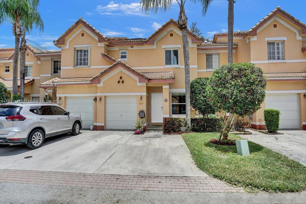 Here it is. A 3 Bed 2.5 Bath 1 Car Garage Lakefront Townhouse in the gated community of Montego Bay, located in the City of Miramar. 1,520 SqFt Under Air. Updated Kitchen with stainless steel appliances. Tile flooring on the first floor and laminated flooring upstairs. Complete Impact Windows & Doors. Solar Panels to reduce the electric bill. A screened-in patio that makes a great area to sip your morning coffee or evening wine while enjoying the water view. There is also room for a BBQ and an herb garden. All bedrooms are located upstairs, as well as your Washer/Dryer. The community features a clubhouse with a pool, as well as two playgrounds and ample guest parking. Low monthly HOA of $180. Located right next door to Lakeshore Park, which has Tennis, Basketball, and Pickleball Courts.