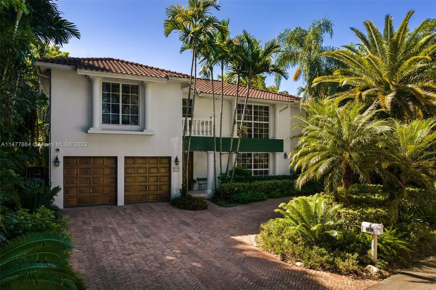 Discover elegance in this two-story Mediterranean sanctuary, wrapped in the calm of towering trees. The grand living room, with its soaring ceilings, bathes in sunlight and offers glimpses of the shimmering, heated pool. The chef-friendly kitchen is accentuated by a convenient breakfast bar. The luxurious master suite boasts a private balcony, spacious sitting area, and an expansive walk-in closet. A stately circular driveway leads to secure parking for two cars, while a generous laundry room completes this splendid residence, epitomizing Coconut Grove sophistication.