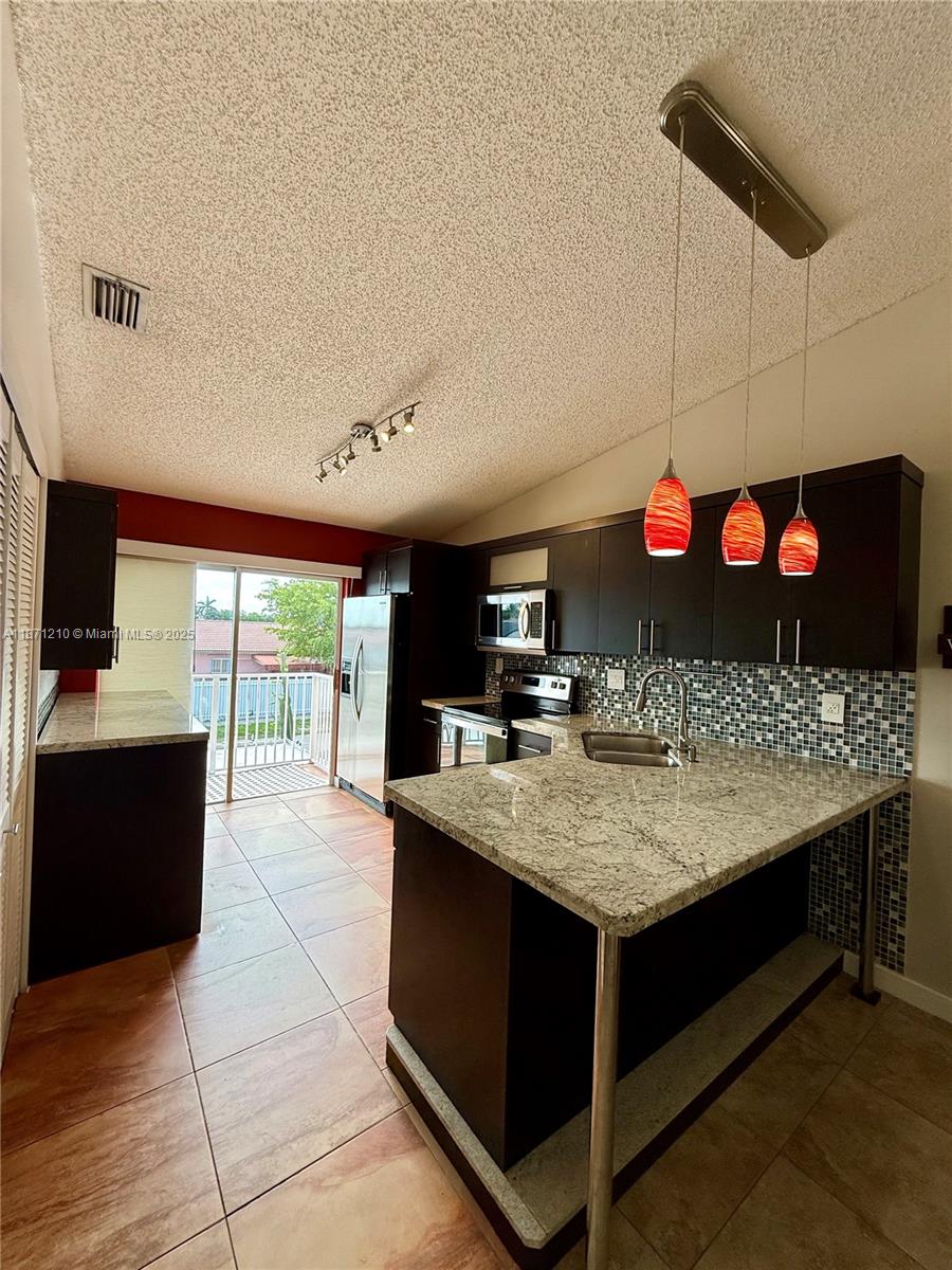 Beautiful 3/2 condo located in Hialeah Gardens. Washer and dryer included in unit, plenty of closet space. The updated kitchen features granite countertops and stainless steel appliances. Two assigned parking spaces with plenty of visitor spaces nearby. Near shopping, restaurant's, major highways and good schools. 1st month and security deposit. Schedule your showing today!