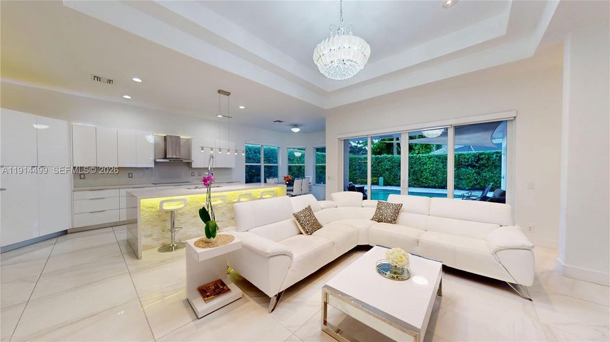 Best-Priced Opportunity in Weston Hills Golf & Country Club! Located in a prestigious guard-gated community, this beautifully maintained single-story 4BR/3BA home offers 2,800 Adj.SF of comfortable living with volume ceilings, natural light, and a modern neutral palette. The updated kitchen features quartz countertops and stainless steel appliances, opening to a breakfast nook with views of the private pool, spacious backyard, and elegant marble stone pool patio—perfect for enjoying South Florida’s outdoor lifestyle. Recent upgrades include impact windows (2022) and a tankless water heater (2024). Low HOA. Strategically priced below recent comparables, this is one of the best values in Weston Hills—an excellent opportunity for buyers seeking both lifestyle and equity. Easy to show to serious buyers with strong pre-appoval