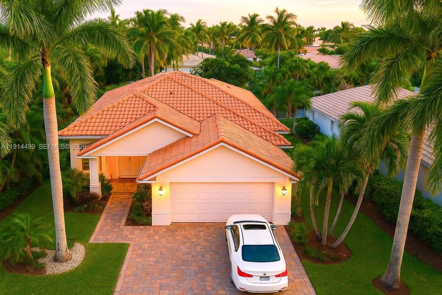 Best Value in Weston Hills Golf & Country Club, a guard-gated community known for privacy, calm, and manicured surroundings. This renewed single-story 4BR/3BA home offers 2,180 SF of comfortable living. Volume ceilings, a soft neutral palette and a well-appointed kitchen with quartz countertops and stainless steel appliances. The breakfast nook opens to the private pool and a generous backyard—perfect for enjoying warm, sunlit days in every season, a lifestyle only South Florida offers. Impact windows (2022), tankless water heater (2024), A/C (2011), roof 2001. Close to A+ schools, parks, and medical centers. Low HOA. Ideal for those seeking a peaceful full-time residence or a graceful winter escape. You are welcome to bring your buyers at your best convenience !