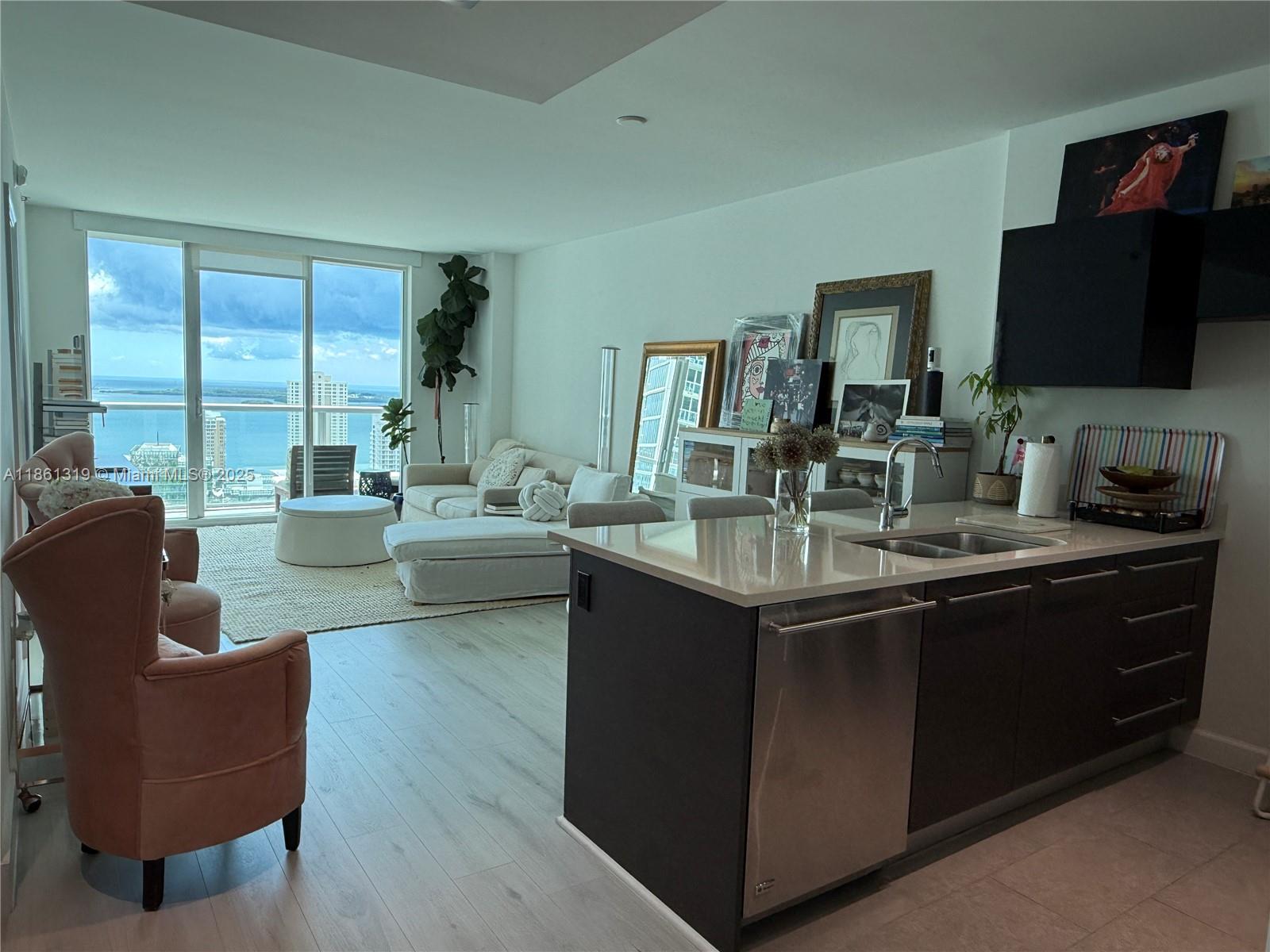 DIRECT water view! A stunning and sophisticated 1 Bedroom + Den, 1 Bath residence in the heart of Brickell. This spacious home features an open floor plan with floor-to-ceiling windows, a modern gourmet kitchen with Italian cabinetry, quartz countertops, and premium GE Monogram and Bosch appliances. The primary suite offers a spa-like bathroom with marble countertops, dual sinks, a glass-enclosed shower, and a luxurious jacuzzi tub. A full-length balcony, elegant finishes, and generous closet space complete this exceptional residence. 500 Brickell East Tower offers a world-class lifestyle, perfectly situated just steps from Brickell City Centre, Mary Brickell Village, and a range of fine dining, shopping, and entertainment options.