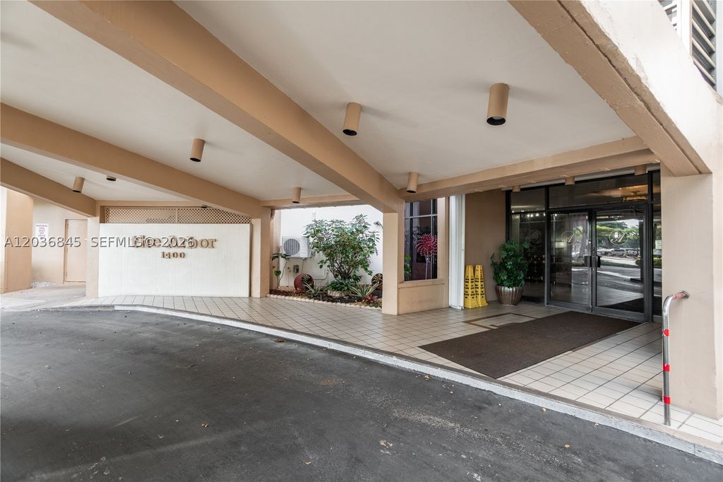 Photo of 1400 Saint Charles Pl #701, Pembroke Pines, FL 33026 (MLS # A12036845)