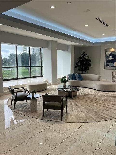 Photo of 20335 W Country Club Dr #302, Aventura, FL 33180 (MLS # A11871144)