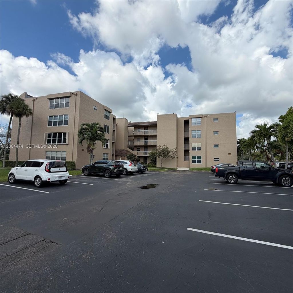 Photo of 9440 Tangerine Pl #206, Davie, FL 33324 (MLS # A12004474)