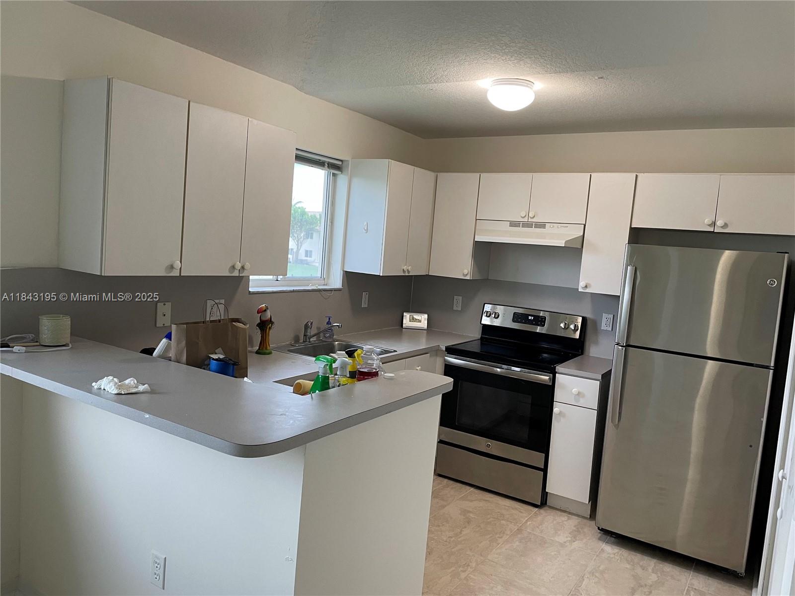 Spacious 3-bedroom, 2-bath condo corner unit that features tile flooring through with washer and dryer inside the unit. Ample primary bedroom with walk-in closet. Gated community with around the clock monitored access, security, a clubhouse, and community pool.