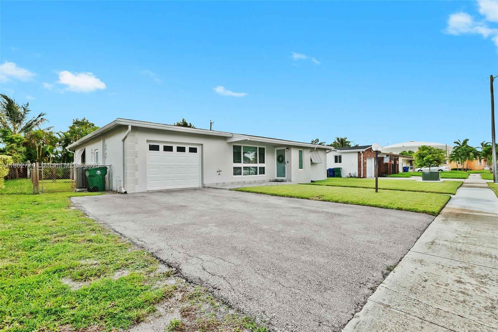 Welcome to this 3/2/1 historic Miramar home conveniently located between The Hardrock Casino and The Hardrock Stadium. This 1637 sq. ft. home is well maintained & includes: a complete package of impact windows and doors-2017 (plus Bahama & accordion shutters) roof-2017, hurricane garage door and tankless water heater-2021, new electrical panel box-2020, Bluetooth smoke and carbon monoxide detectors, LED can lights-2020, pool pump-2022, HVAC-2017. Chef's kitchen has stainless steel package, granite counters, pass thru window to screened poolside oasis for dinning alfresco. Tiled floors throughout entire home. Both baths completely updated in 2022 with lighted mirrors, bluetooth fans, and smart speakers. Exterior painted-2023, Irrigation system. Termite tent-June 2025. This is a must see!