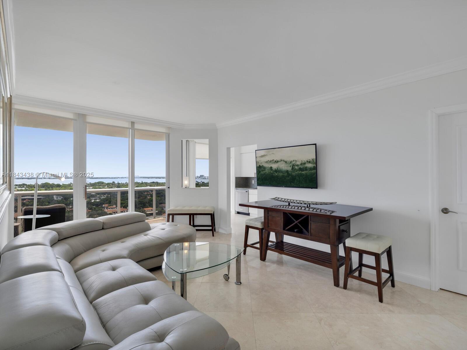 This spacious 1-bedroom, 2-bath residence with a den that has been thoughtfully converted into a second bedroom—boasts panoramic views of the bay, Intracoastal, and Miami skyline. The en suite primary bedroom features floor-to-ceiling windows, a generous walk-in closet, and a large bathroom with a separate shower and jacuzzi tub. Marble floors flow throughout, and a large terrace offers the perfect setting for relaxing or entertaining. Offered furnished. Residents enjoy access to outstanding amenities and full-service living in a premier Miami Beach building. Available Nov.1 for 6 Months.