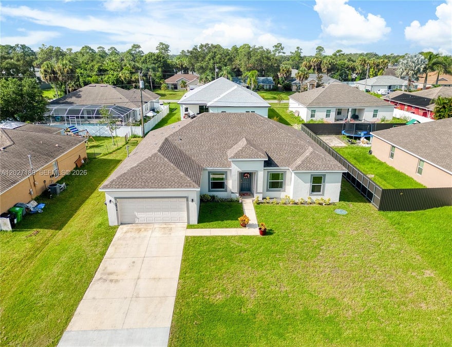 Beautiful newer construction CBS home built in 2022 located in the highly desirable Port St. Lucie area. This well-maintained home features an open-concept layout with spacious living areas, modern finishes, and abundant natural light throughout. The kitchen offers ample cabinet space, stainless steel appliances, and a functional design perfect for entertaining and everyday living. The primary suite includes a large walk-in closet and private bath. Enjoy a spacious backyard with plenty of room to relax or create your outdoor oasis. Conveniently located near shopping, dining, parks, schools, and major highways. No HOA.