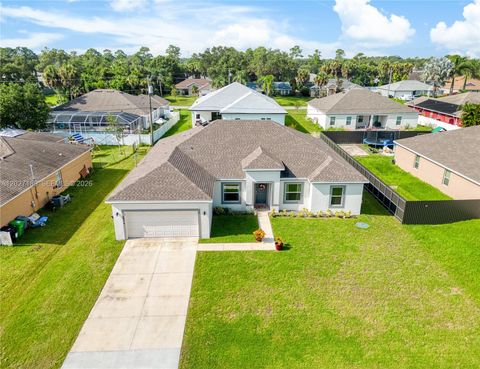 Photo of 1534 SW Abingdon Ave, Port St Lucie, FL 34953 (MLS # A12027189)