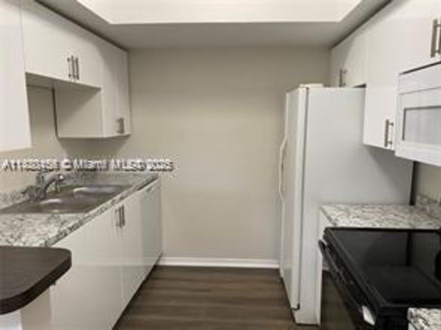 Beautifully renovated 3BR/2.5BA townhome located in a quiet family neighbourhood. Brand new kitchen features white gloss modern cabinets, new countertop, new microwave and dishwasher, new lighting and much more. New laminate/vinyl flooring throughout, new spot lights in the living room, freshly painted. Bathroom Jacuzzi tub and enclosed shower glass door. French doors leading to a large screened patio and enclosed laundry room. Fenced in private backyard. No association approval, move right in, credit score must be 650 or higher. Will not last.