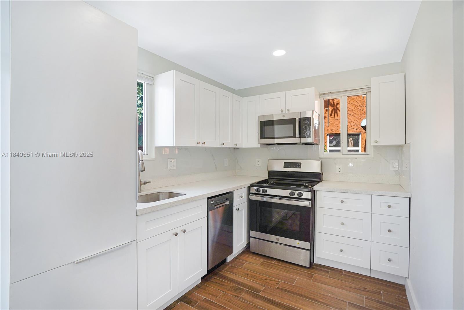 Welcome to this fully remodeled and spacious home — a blank canvas with high-end finishes, ready for your personal touch. Enjoy the charm of just-polished original hardwood floors and an inviting L-shaped kitchen perfect for cooking. Located just a short walk from the restaurants, bars, and parks along Hollywood Blvd, and only a 12-minute Uber ride to the beach. The home features a private yard and ample parking for 3–4 cars.