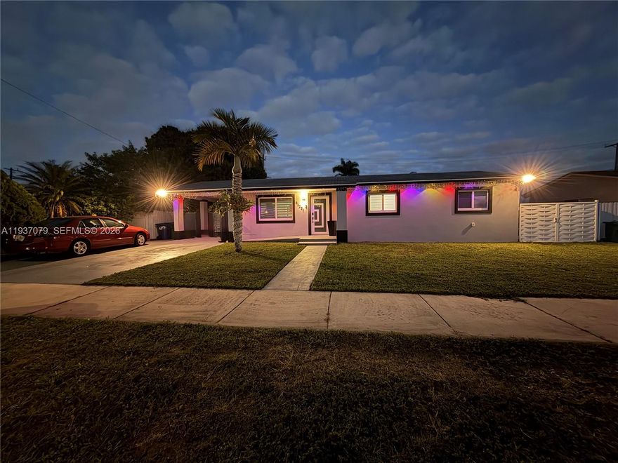 Located on a private street, this modern architectural gem was custom remodeled offering exceptional design, technology, and functionality unmatched in Miami Gardens, just minutes from banks, restaurants, major highways, Hard Rock Stadium, schools and Calder Casino.

This unique home features wall-to-wall 18-inch white ceramic tile and a stunning chef’s kitchen with solid wood lacquer cabinetry, large granite island, stainless steel smart appliances, chef-grade stove with hidden spice storage, pantry, and indoor laundry.

Designed for both entertaining and everyday comfort, the home includes extensive smart-home technology for lighting and appliances, built-in charging stations, security system, Tesla EV car charger, impact windows and doors, tankless water heater, and PVC fencing. A striking built-in wall aquarium with private service room anchors the open living, dining, and kitchen areas.

The expansive entertainment lanai offers two separate gathering areas. A full outdoor kitchen with granite countertops for seating, grill, appliances, and a bar area, with exterior audio wiring. A cabana bath for outdoor use is a plus. The oversized backyard has room for a pool, includes a shed, and a pool table which conveys to the buyer.

A large accessory dwelling unit (ADU) with private entrance and interior access features a living room, bedroom, walk-in closet, and full bath—ideal for guests or multigenerational living. With ample parking buyers will love this home!
