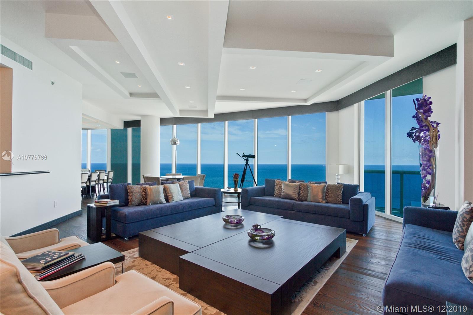 Breathtaking oceanfront Sky Residence, South-East Corner unit. 5086 Sq.ft under A/C, 920 sq.ft private terraces.
5bd, 6.5 bths, plus library TV room living, dining area & gourmet kitchen. Settled on 270 feet of pristine white
sand. Enjoy panoramic views of the Atlantic, Intracoastal and city skyline from 11'' floor-to-ceiling impact proof
windows and wrap-around terraces. This Home is professionally decorated, the custom kitchen offers designer
appliances, including temperature-controlled wine storage and a Miele espresso machine. Perfect for entertaining,
this residence features an elegant dining room with spacious family room, all with ocean or Intracoastal views.