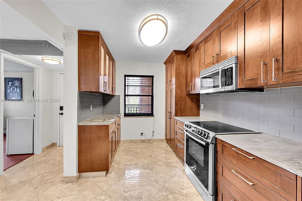 Photo of 10501 W Broward Blvd #311, Plantation, FL 33324 (MLS # A11938676)